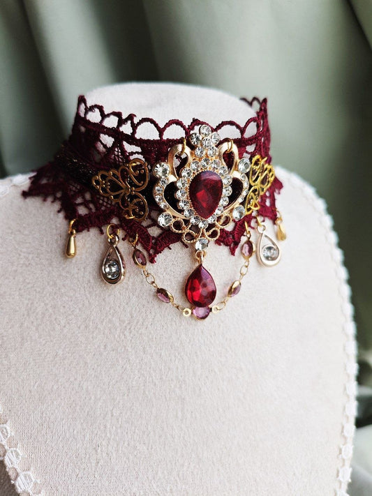 Close-up of Ruby Sovereign handmade red gothic lace choker details