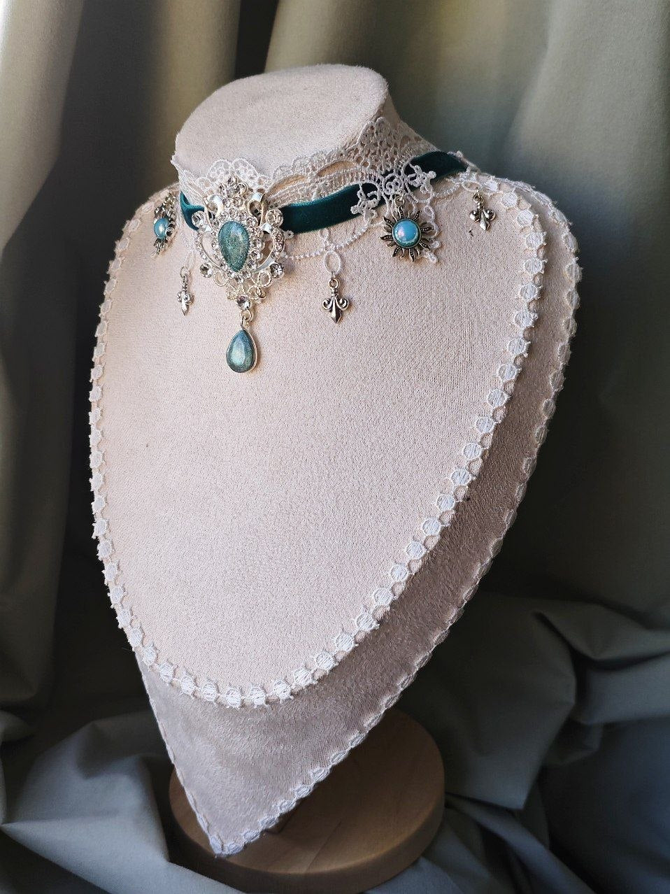 Angled view of Aqua Regalia fantasy choker with turquoise teardrop pendant