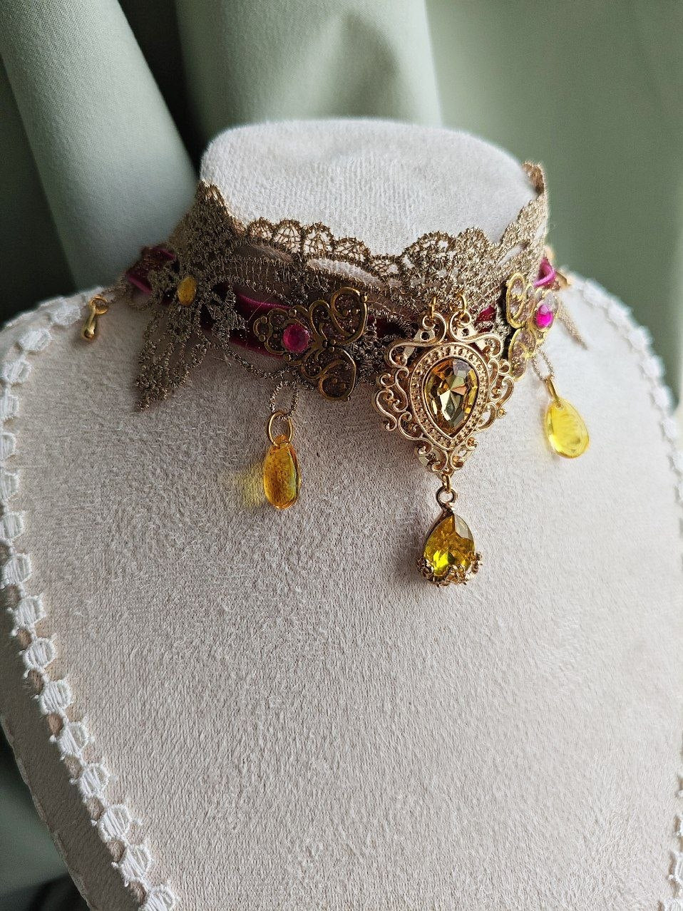 Close-up of Solaris Gilded handmade gold and pink sun choker details