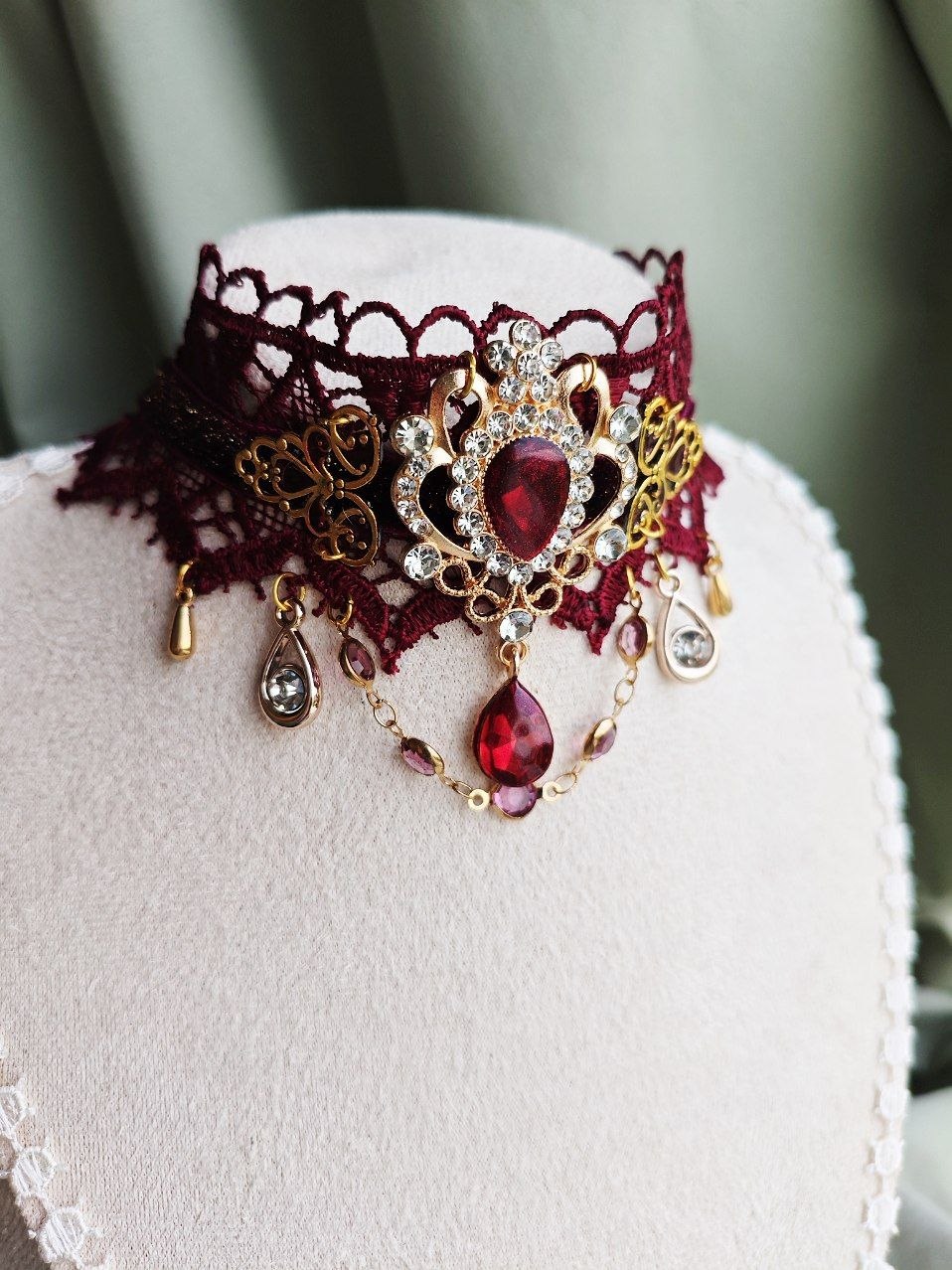 Close-up of Ruby Sovereign handmade red gothic lace choker details