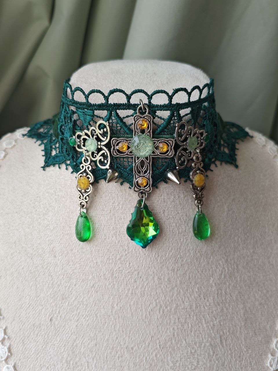 Close-up of Golden Ivy Prayer choker with green crystal drops